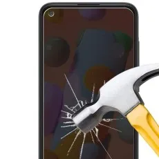 Hammer striking a privacy screen protector on a Samsung Galaxy A11, showing impact resistance.