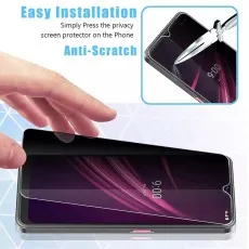 Infinix Note 12 (2023) being fitted with privacy protector, highlighting easy setup and scratch defense.
