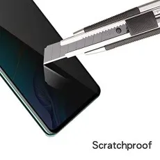 Scratchproof privacy screen protector being tested with a utility knife.