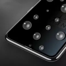 Close-up of a Huawei with a privacy screen protector applied, showing a darkened display.