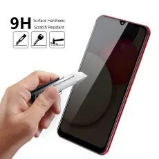 A hand uses a utility knife to scratch a smartphone screen, illustrating its 9H scratch resistance