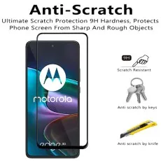 Anti-scratch screen protector with 9H hardness for a Motorola phone, showing protection from keys and a knife