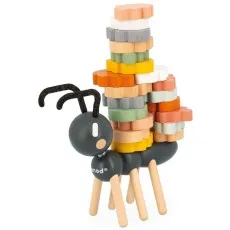 A black wooden ant with long, wobbly legs balancing a precarious tower of colored blocks.