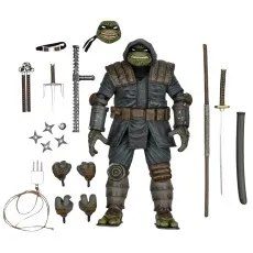 A hooded Ninja Turtle action figure with various weapons and interchangeable parts.