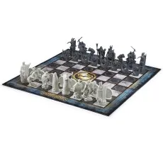 A side view of The Lord of the Rings chess set on a white background, highlighting the two opposing armies