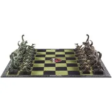 A head-on view of the Jurassic Park chess set, with the two sides of dinosaur pieces facing each other on the board