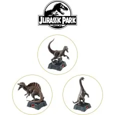 A Jurassic Park logo with close-ups of three different dinosaur chess pieces