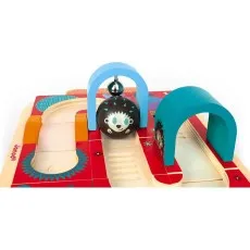 A wooden hedgehog maze toy by Janod, showing a hedgehog ball rolling under a blue arch