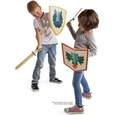 Two children play-fighting with wooden toy swords and shields—a boy with a wolf design and a girl with a dragon design