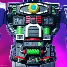 Close-up of Optimus Prime's open chest showing intricate internal mechanics with green, red, black, and yellow parts