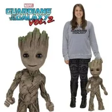 A woman and a large and small Baby Groot figure from Marvel's Guardians of the Galaxy Vol. 2