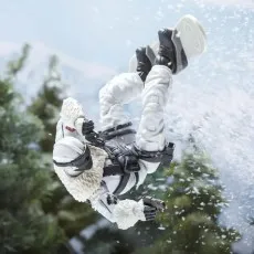 G.I. Joe Snow Serpent action figure performing an upside-down trick on a snowboard in the air.