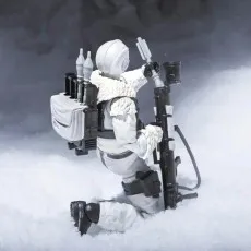 G.I. Joe Snow Serpent figure kneeling in the snow, preparing a large shoulder-fired weapon.