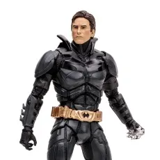 Close-up of a realistic Batman collectible figure with a gold utility belt.